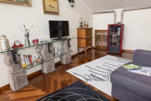 a living room with a couch and a refrigerator at Patrian in Grottaferrata