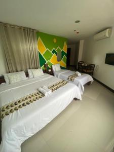 Rúm í herbergi á BOPEMPC Safari Hostel