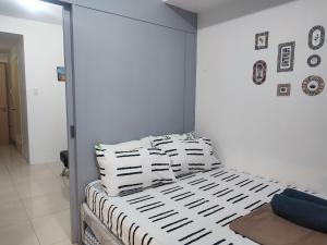 Voodi või voodid majutusasutuse Sea Residences MOA Complex - Ruffa's Condotel toas