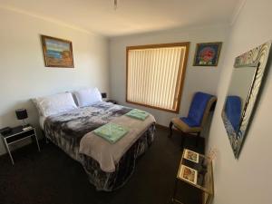 Letto o letti in una camera di Pull Up Stumps