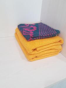 a pile of towels sitting on top of a counter at квартира in Pavlodar