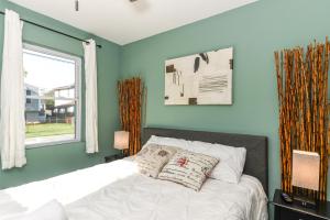 a bedroom with a bed and a window at Off The Beaten Path Rancher! Beautifully Made in Rosedale