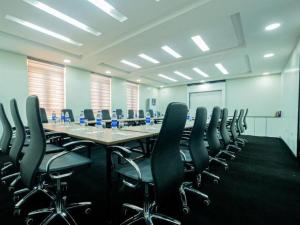 a large conference room with a long table and chairs at BON Hotel Nest Ibadan in Ibadan