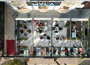 an overhead view of a parking lot with people at MYLA Hotel Tuzla in Tuzla