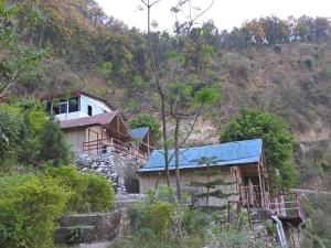 a house on the side of a mountain at Hills Of Adventure, Keshudhar, Lansdowne in Lansdowne