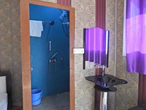 a bathroom with a shower and a sink at Hills Of Adventure, Keshudhar, Lansdowne in Lansdowne