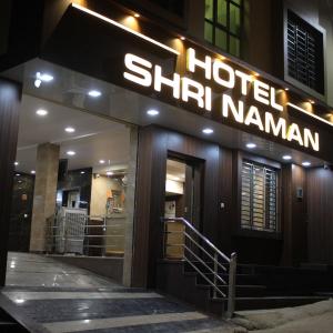 a hotel sign on the side of a building at Maruti Group of Hotels - Shri Naman in Nāthdwāra
