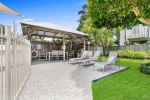 a patio with chairs and a gazebo at Terrapin Apartment 4 in Noosaville +7 photos