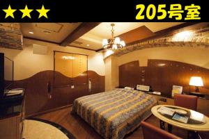 HOTEL Us Bentenbashi Adult onlyにあるベッド