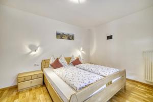 Ένα ή περισσότερα κρεβάτια σε δωμάτιο στο Boznermüllerhof - Geranie