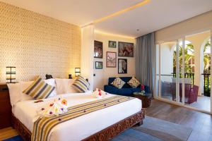 Llit o llits en una habitació de The Mora Zanzibar - Luxury All Inclusive