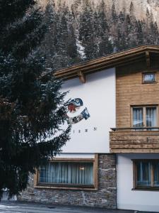 a building with a sign on the side of it at Chalet Pfunds in Pfunds