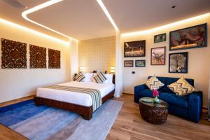 Llit o llits en una habitació de The Mora Zanzibar - Luxury All Inclusive
