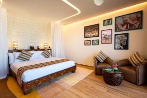 Llit o llits en una habitació de The Mora Zanzibar - Luxury All Inclusive
