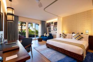 Llit o llits en una habitació de The Mora Zanzibar - Luxury All Inclusive