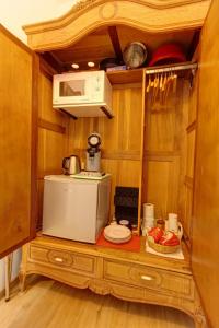 a kitchen with a counter with a microwave and a microwave at Love Nest Versailles - Unique Louis XIV decoration - Calm location right IN city center in Namur