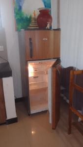 a wooden dresser with a drawer in a room at chamika house in Matara