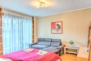 Posteľ alebo postele v izbe v ubytovaní Central Apartments