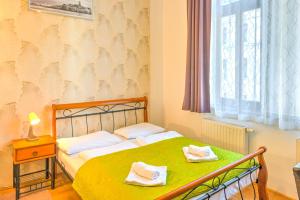 Posteľ alebo postele v izbe v ubytovaní Central Apartments