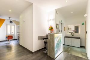 a room with white walls and a counter at La Riviere Guesthouse Trastevere in Rome