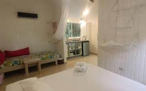 Posteľ alebo postele v izbe v ubytovaní Boho lodge Montezuma l&l