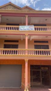 a building with a sign on the front of it at Siem Reap Holiday Guest House or Motel in Siem Reap