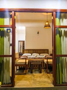 a room with a bed and a room with a table at Light house beach home in Matara