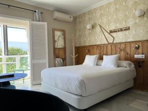 Posteľ alebo postele v izbe v ubytovaní Alameda Hostal Boutique + 37 fotografií