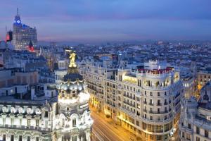 an aerial view of a city at night at The Principal Madrid, Small Luxury Hotels in Madrid