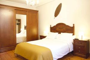 A bed or beds in a room at Apartamento CUNTIS