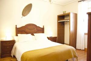 A bed or beds in a room at Apartamento CUNTIS