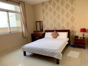 Posteľ alebo postele v izbe v ubytovaní NGỌC MẤY - ĐẠI LỢI HOTEL