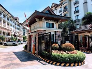 a building with a gate in front of a street at 1bedroom one oasis condo fullyfurnished in Davao City