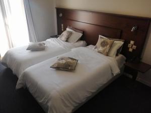 A bed or beds in a room at Liknon