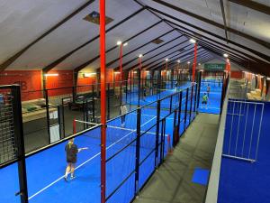 an overhead view of a tennis court with people in it at Hytten in Lemvig