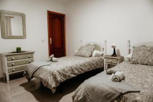 A bed or beds in a room at Casa Las Costas, Las Maretas