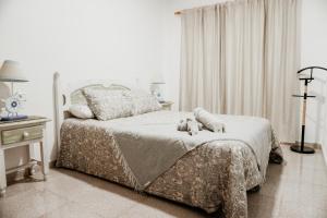 A bed or beds in a room at Casa Las Costas, Las Maretas