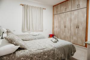 A bed or beds in a room at Casa Las Costas, Las Maretas