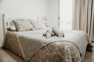 A bed or beds in a room at Casa Las Costas, Las Maretas
