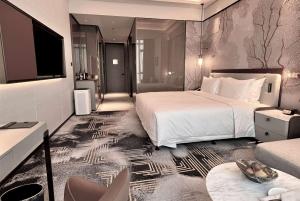 Ένα ή περισσότερα κρεβάτια σε δωμάτιο στο Wyndham Shanxi Xiaohe Xincheng