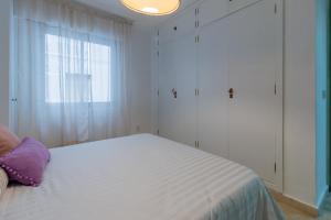 Posteľ alebo postele v izbe v ubytovaní Apartamento Centrico Isaura