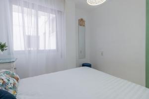 Posteľ alebo postele v izbe v ubytovaní Apartamento Centrico Isaura