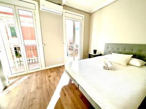 Posteľ alebo postele v izbe v ubytovaní Sunny apartment Gracia - Joanic Renovated