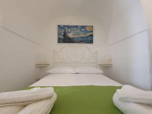 A bed or beds in a room at Il sottano alla strada Polignano a mare