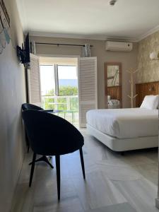 Postel nebo postele na pokoji v ubytování Alameda Hostal Boutique