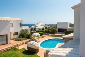 a view of a villa with a swimming pool at Lasaienea 4 bedroom villa, Cala Morell in Cala Morell