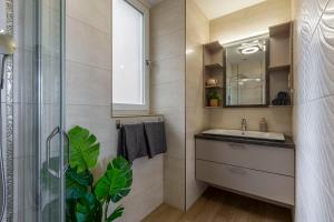 a bathroom with a sink and a mirror at Luxury Residence with a Beautiful view for the Danube River in Budapest +18 photos