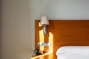 Postel nebo postele na pokoji v ubytování Onix Rambla