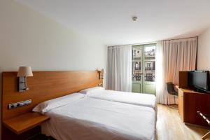 Postel nebo postele na pokoji v ubytování Onix Rambla