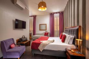 Ліжко або ліжка в номері Navona Colors Hotel